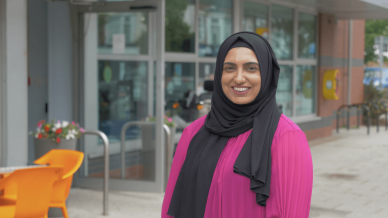 Anila standing at the community centre