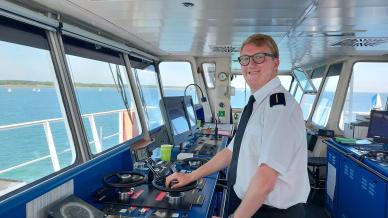 Picture of WEA learner Michael in the cockpit of a boat
