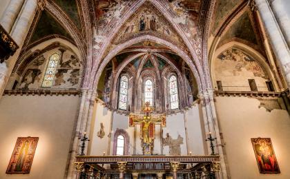 The apse and main crucifix inside the Basilica of Santa Chiara in the heart of Assisi in Umbria