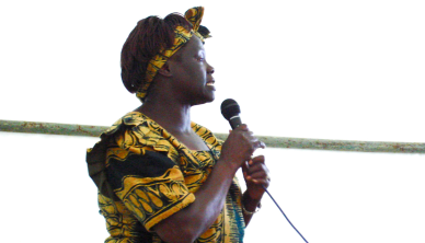 Image of Wangari Maathai holding a microphone