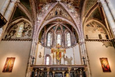 The apse and main crucifix inside the Basilica of Santa Chiara in the heart of Assisi in Umbria